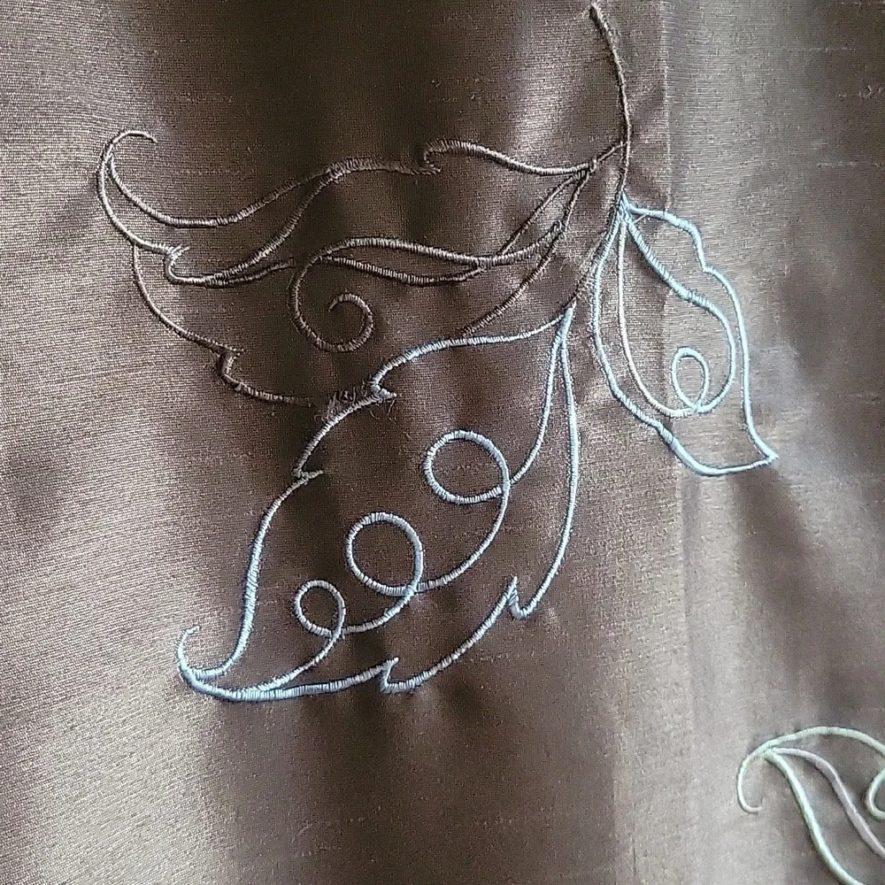 Brown shower curtain with embroidered flowers